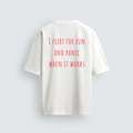 A back view of a white oversized heavyweight t-shirt featuring the humorous text "I FLIRT FOR FUN AND PANIC WHEN IT WORKS" printed in red capital letters.