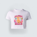 A white cropped baby tee for girls featuring a vibrant graphic of a cute orange kitten, a rainbow, flowers, and the sarcastic text Alpha Male in bold pink lettering.