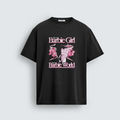 A black unisex t-shirt featuring a graphic print of Oppenheimer enveloped in pink smoke with the text I'm A Barbie Girl In A Barbie World in a stylized pink font.