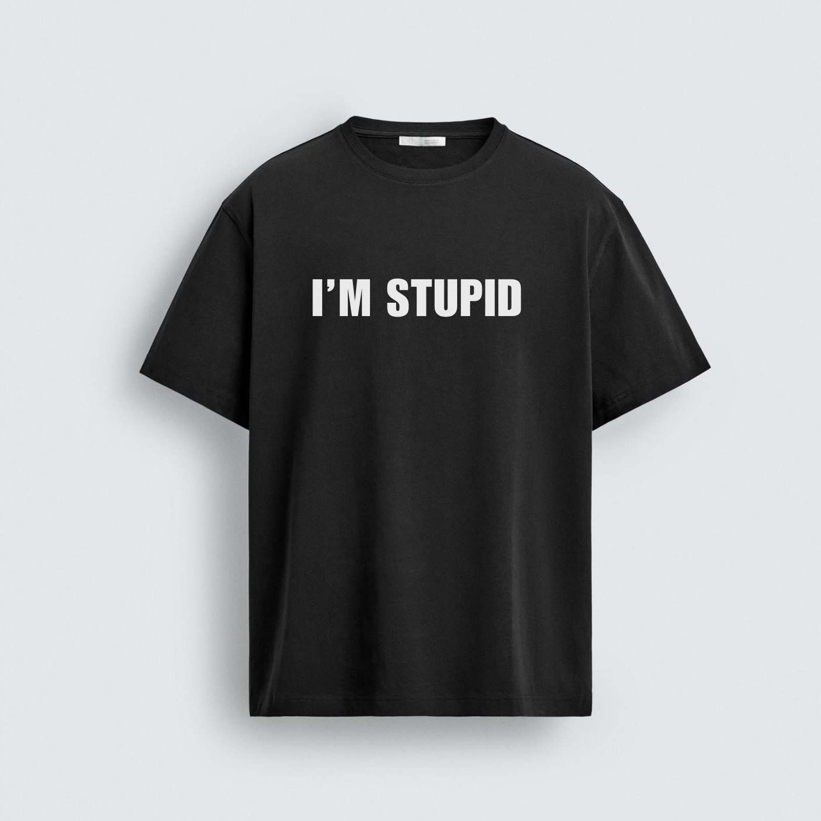 Black oversized unisex t-shirt with bold white text reading "I'M STUPID" printed on the chest. Part of a two-piece couple's combo tee set.