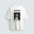 A white unisex oversized streetwear t-shirt featuring a black and white graphic on the center chest with the word "MISSING" above a portrait of Kanye West and the text "THE OLD KANYE" underneath.