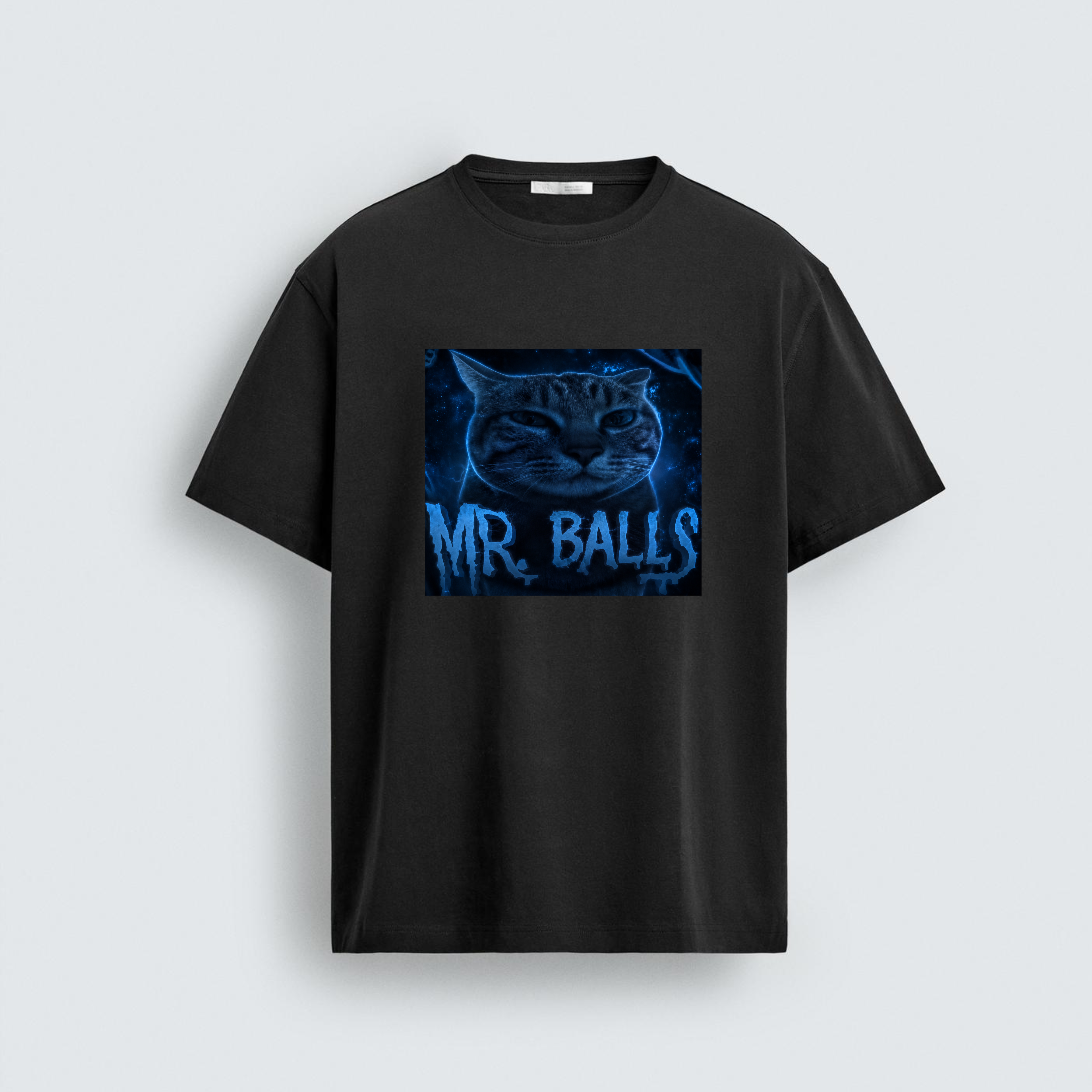 A regular fit black t-shirt featuring a glowing blue cosmic cat graphic with the text Mr. Balls written in a dripping neon font across the chest.