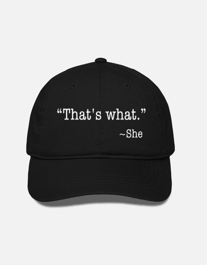 A classic black dad hat featuring the white embroidered text "That's what." quoted by "~She" centered on the front panels.
